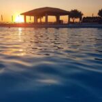kamarina-resort-esterni-piscina tramonto